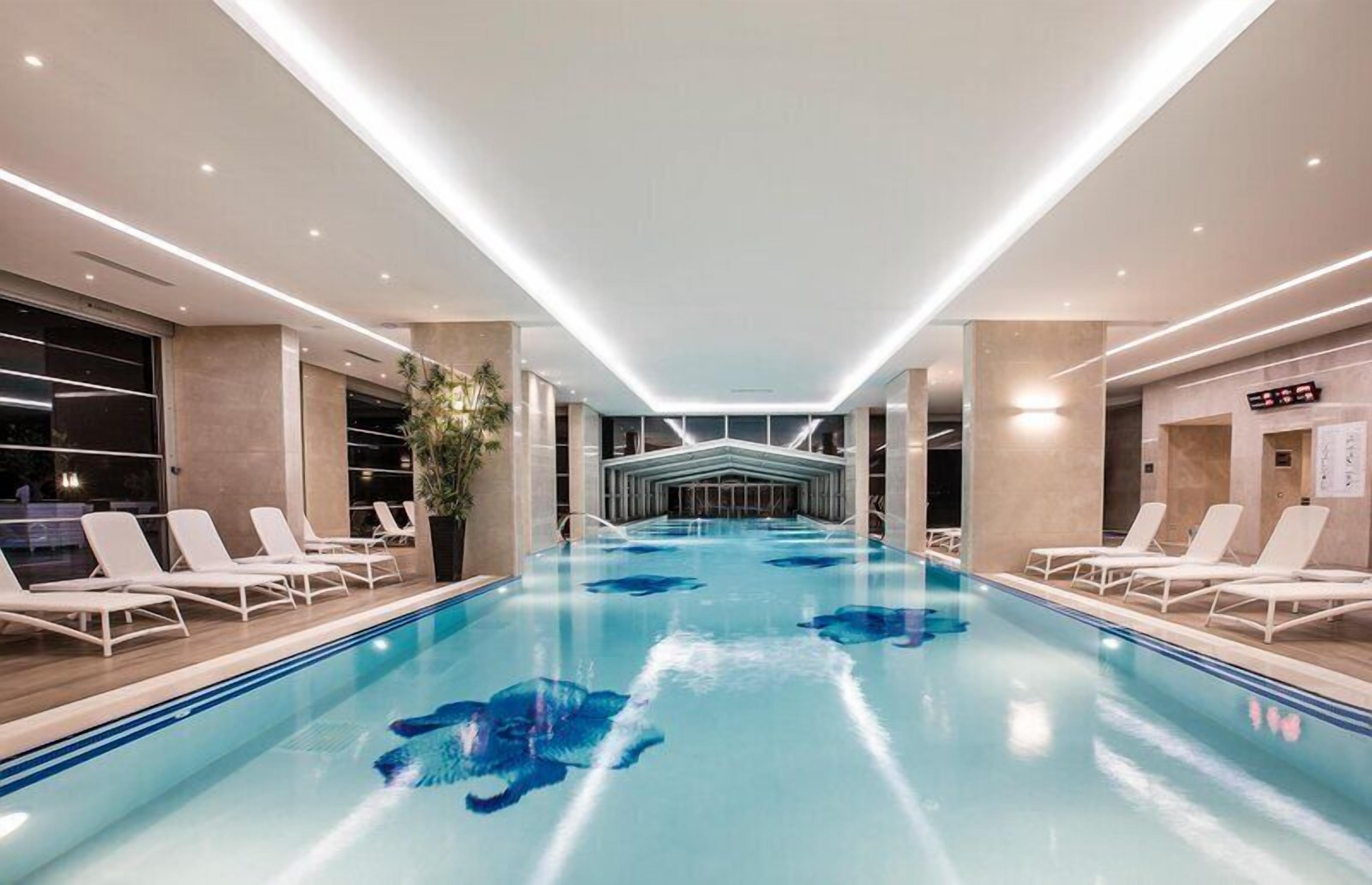 Indoor pool, outdoor pool, pool umbrellas, sun loungers