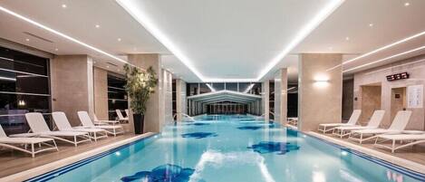 Indoor pool, outdoor pool, pool umbrellas, pool loungers