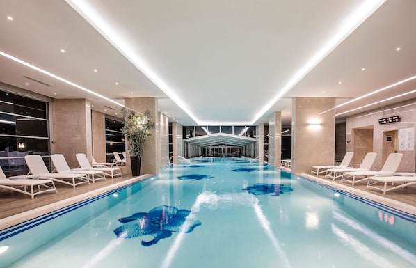 Indoor pool, outdoor pool, pool umbrellas, pool loungers