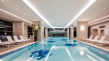 Indoor pool, outdoor pool, pool umbrellas, sun loungers