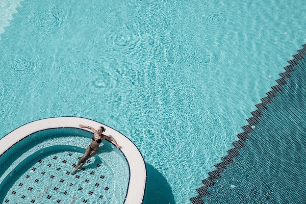 Indoor pool, outdoor pool, pool umbrellas, sun loungers