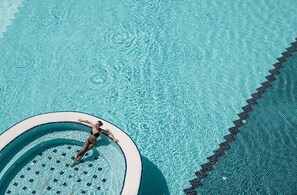 Indoor pool, outdoor pool, pool umbrellas, pool loungers