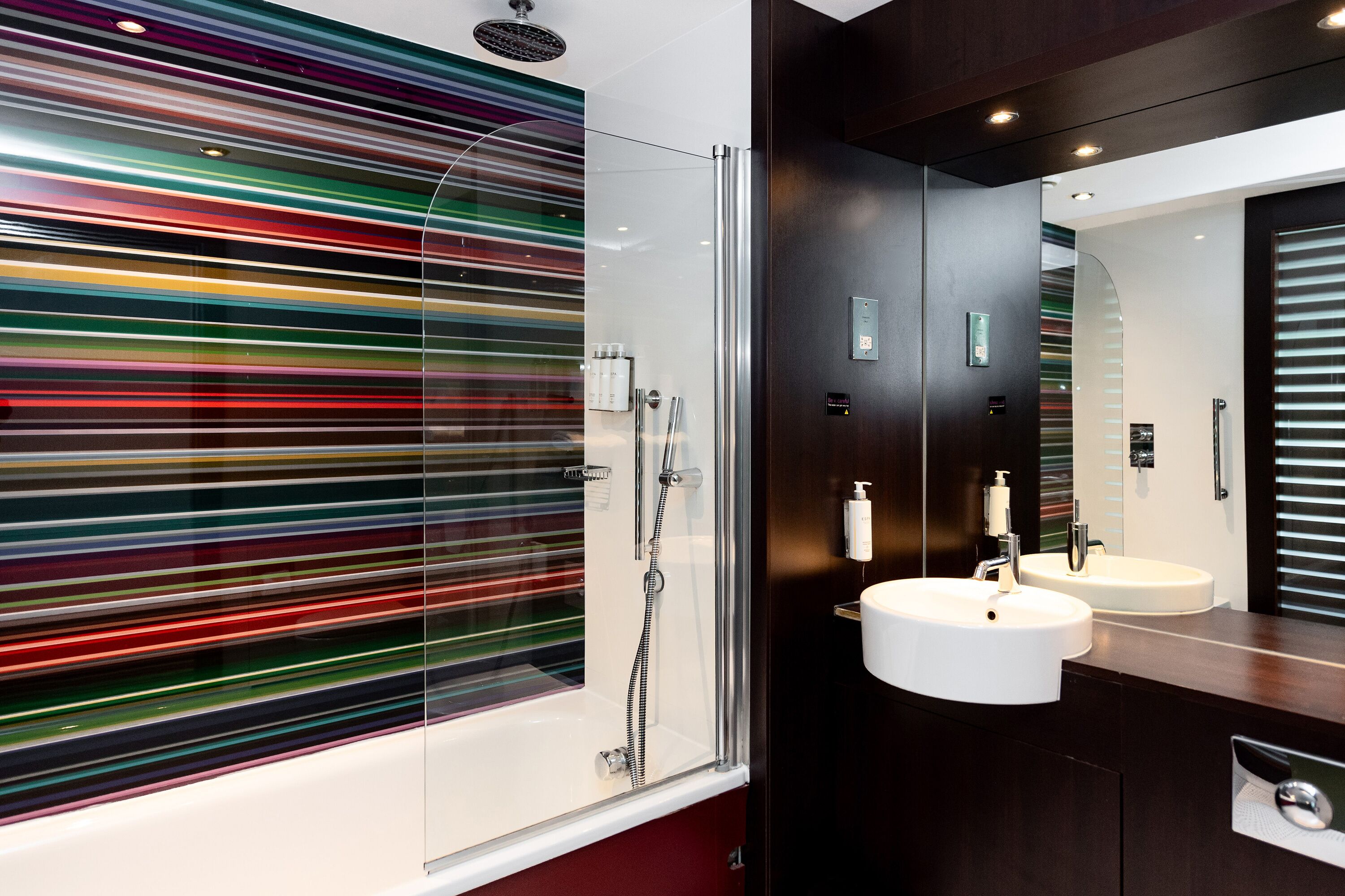 rainfall showerhead, eco-friendly toiletries, hair dryer, towels