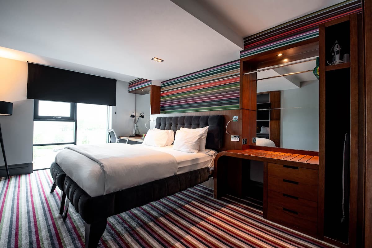 desk, laptop workspace, blackout curtains, iron/ironing board