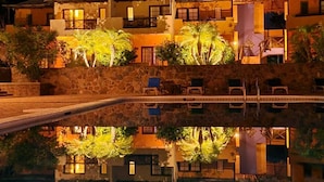 A two-story building with a pool in the foreground. - Hotel Tripui (Loreto)