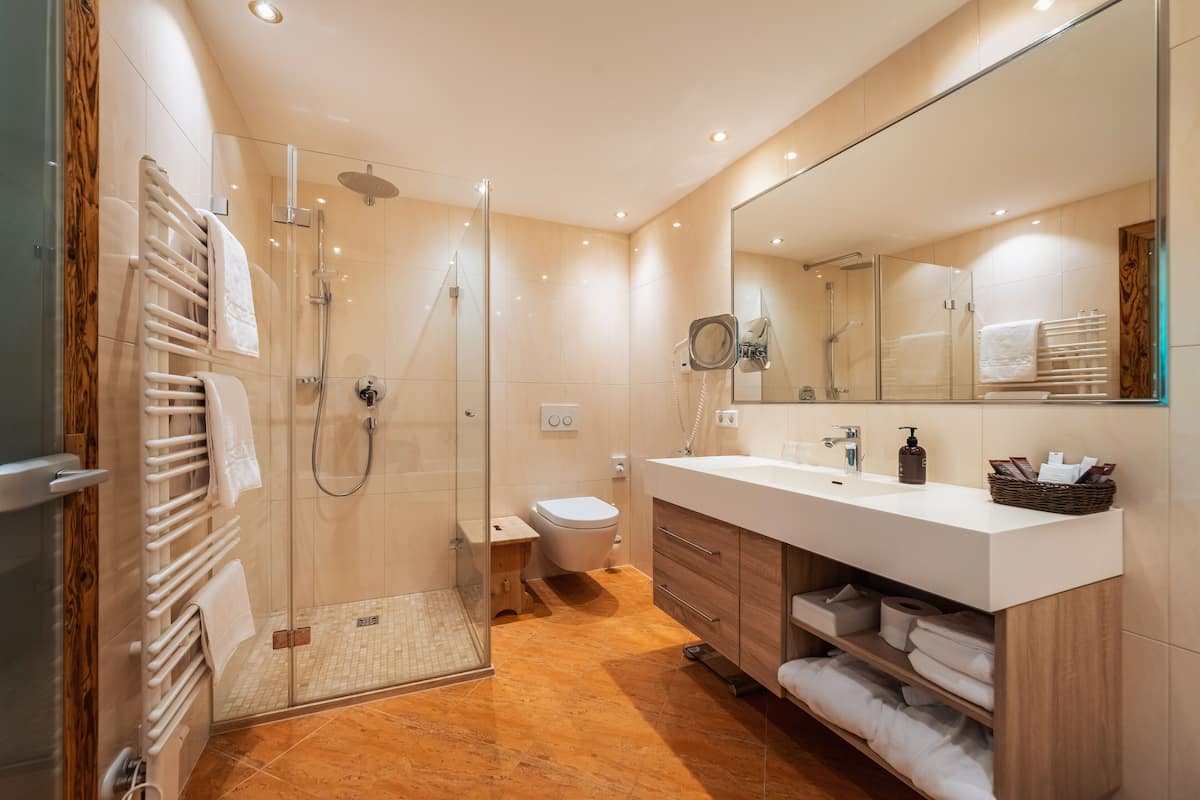 suite | bathroom | shower, hair dryer, bathrobes, slippers