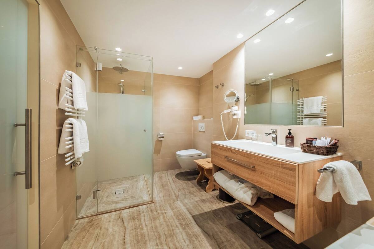 suite | bathroom | shower, hair dryer, bathrobes, slippers