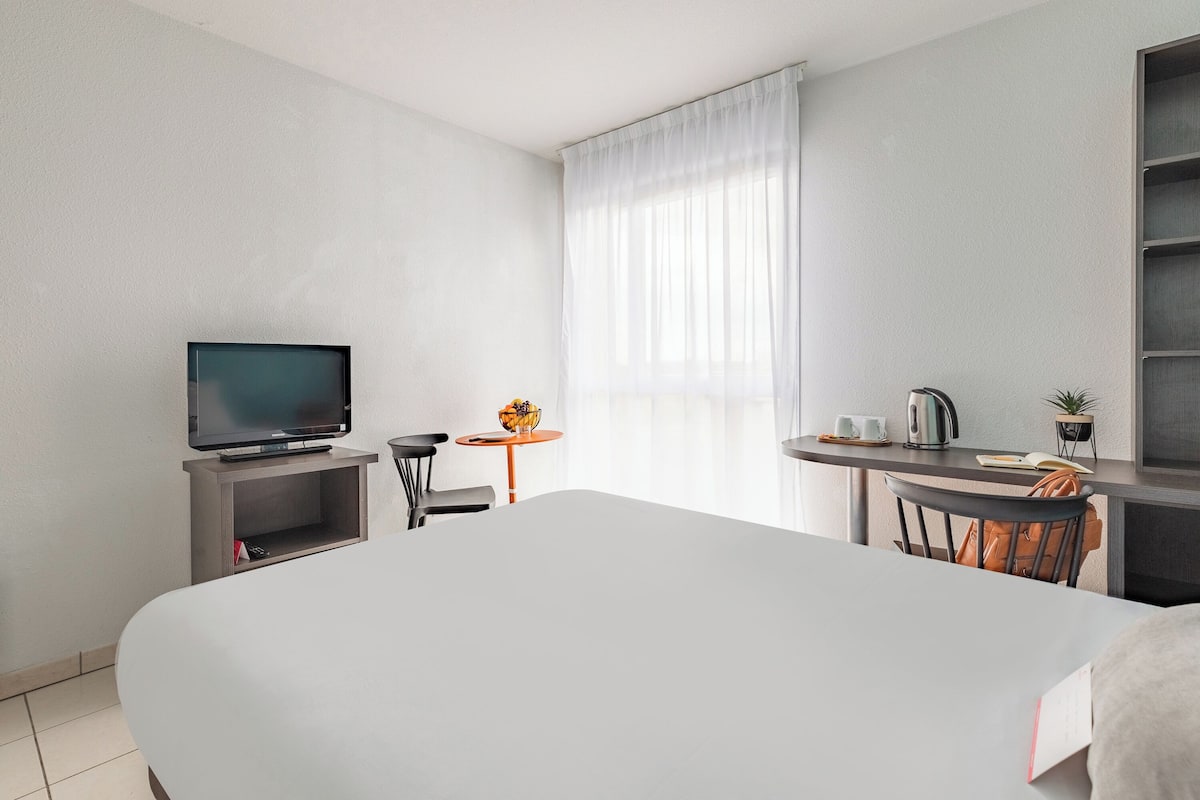 Desk, blackout curtains, iron/ironing board (on request)