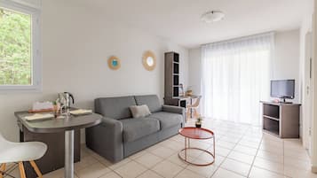 Apartment, 1 Bedroom | Living area | Flat-screen TV