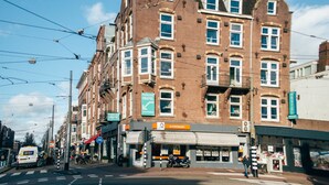 A traditional European building with a sign for a Princess Hostel. - Princess Hostel Amsterdam (Amsterdam)