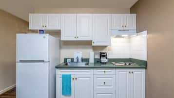 Full-size fridge, microwave, stovetop, coffee/tea maker
