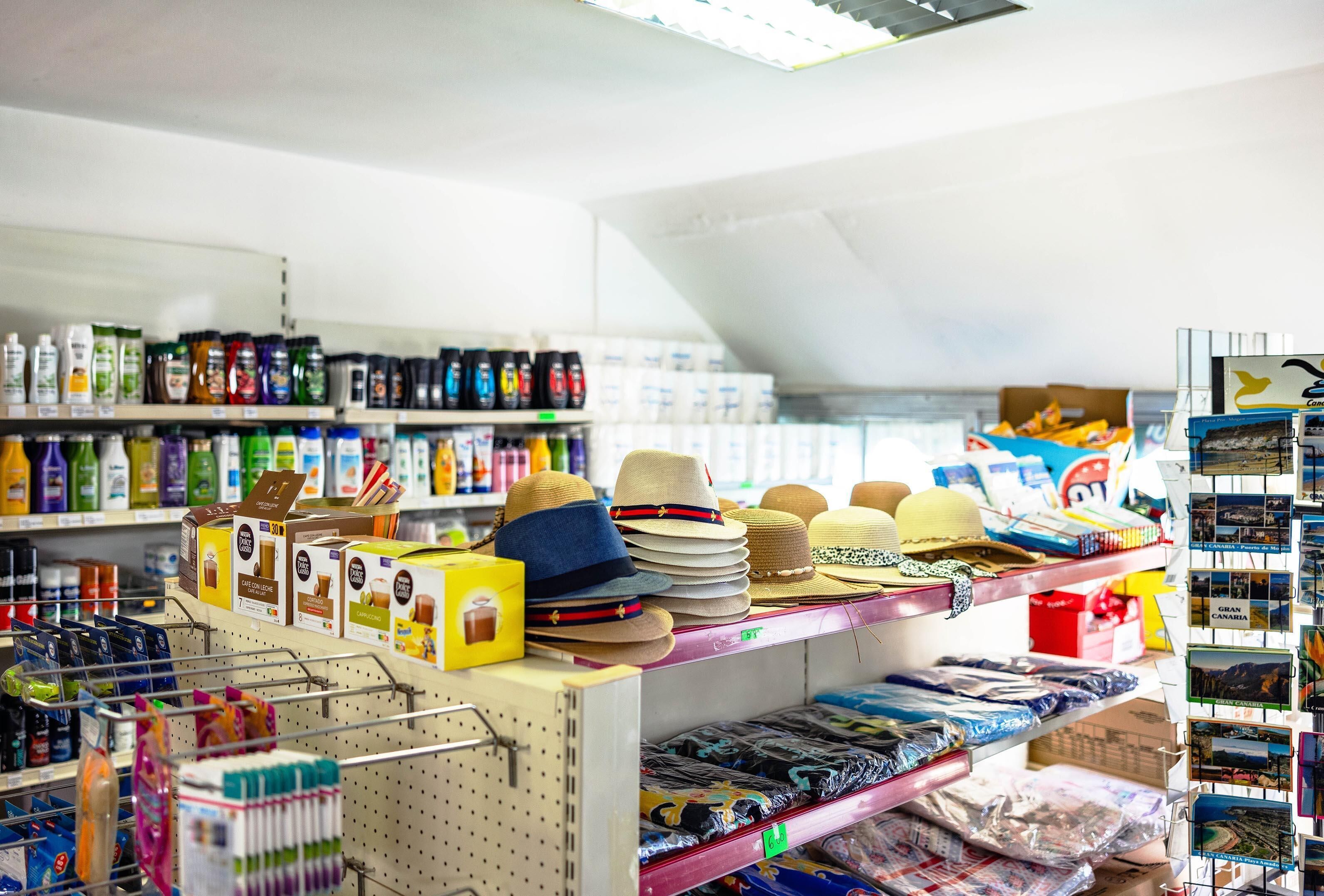 A store with shelves stocked with hats and other items.