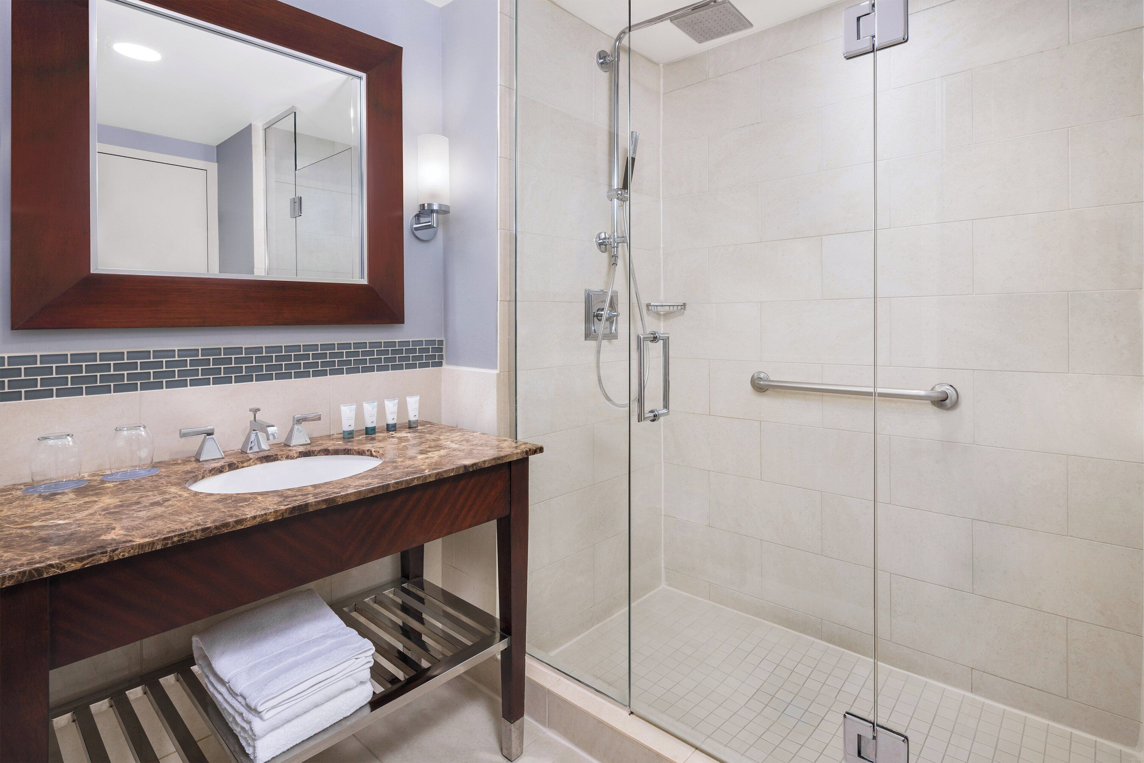 combined shower/bathtub, designer toiletries, hair dryer, bathrobes
