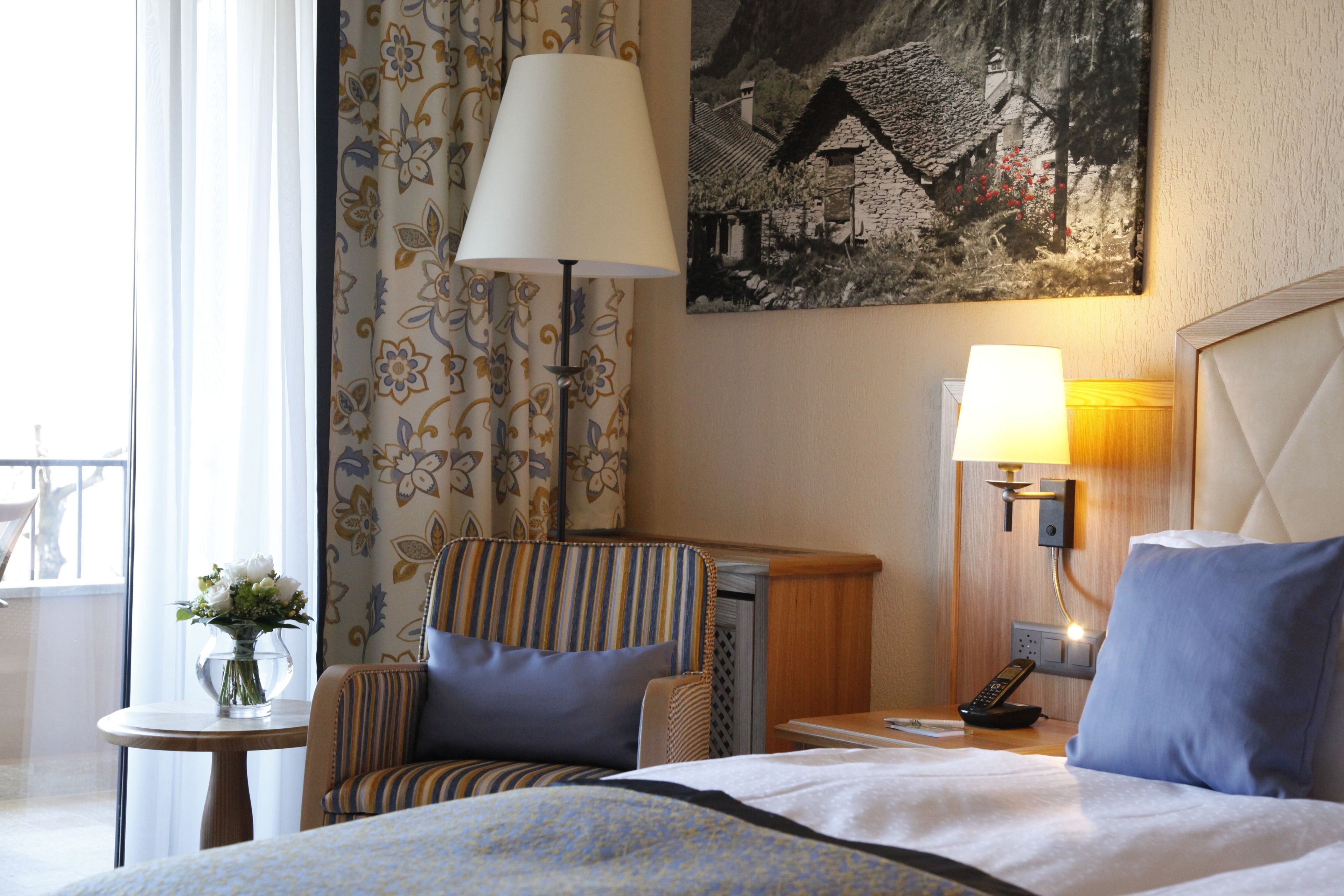 comfort double room, partial lake view | hypo-allergenic bedding, down duvets, minibar, in-room safe