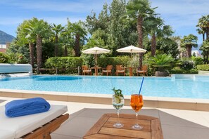 Seasonal outdoor pool, pool umbrellas, pool loungers