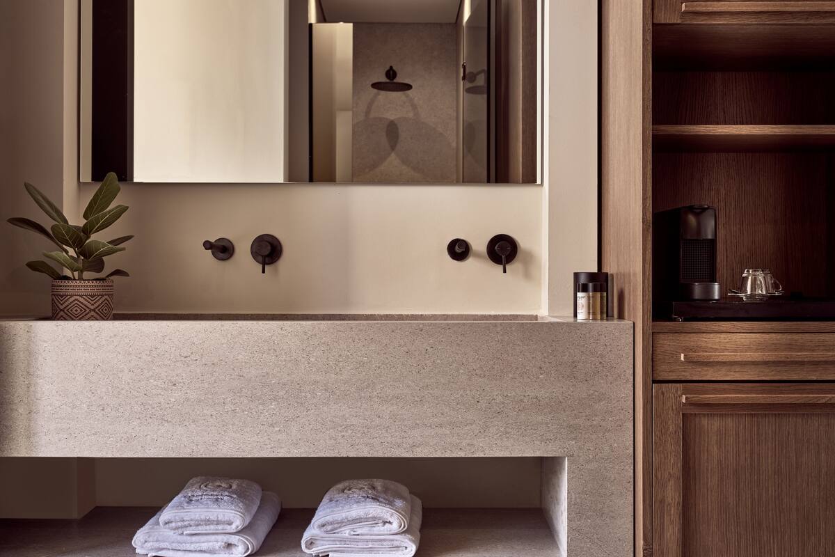 shower, designer toiletries, hair dryer, slippers