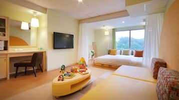 Relax in a spacious room with a large bed, desk, and TV, offering a view of the outdoors.