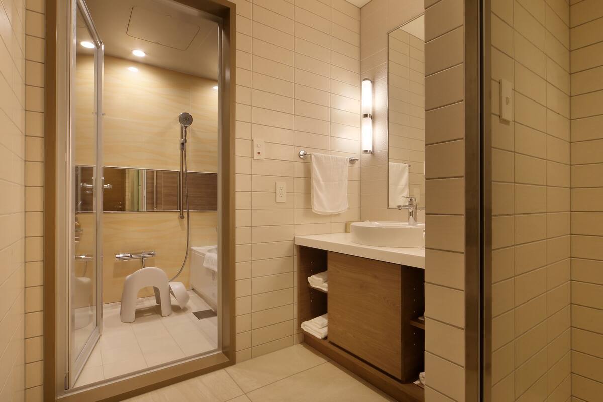 junior suite with mountain view - in-room french dinner and breakfast included | bathroom | free toiletries, hair dryer, slippers, electronic bidet