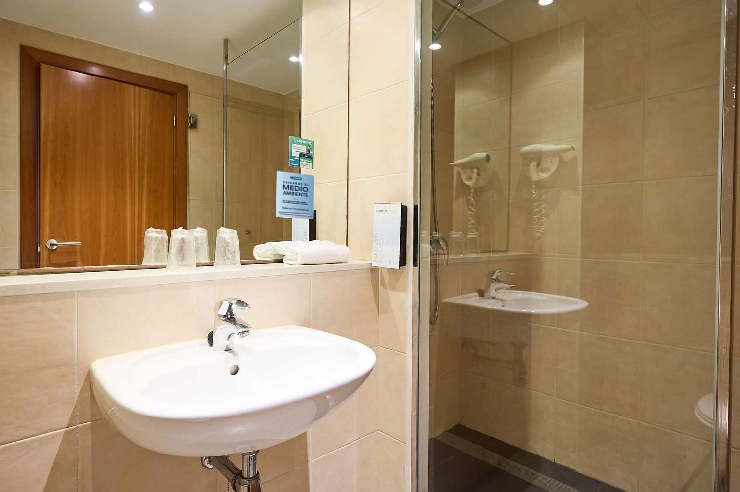 eco-friendly toiletries, hair dryer, towels, shampoo