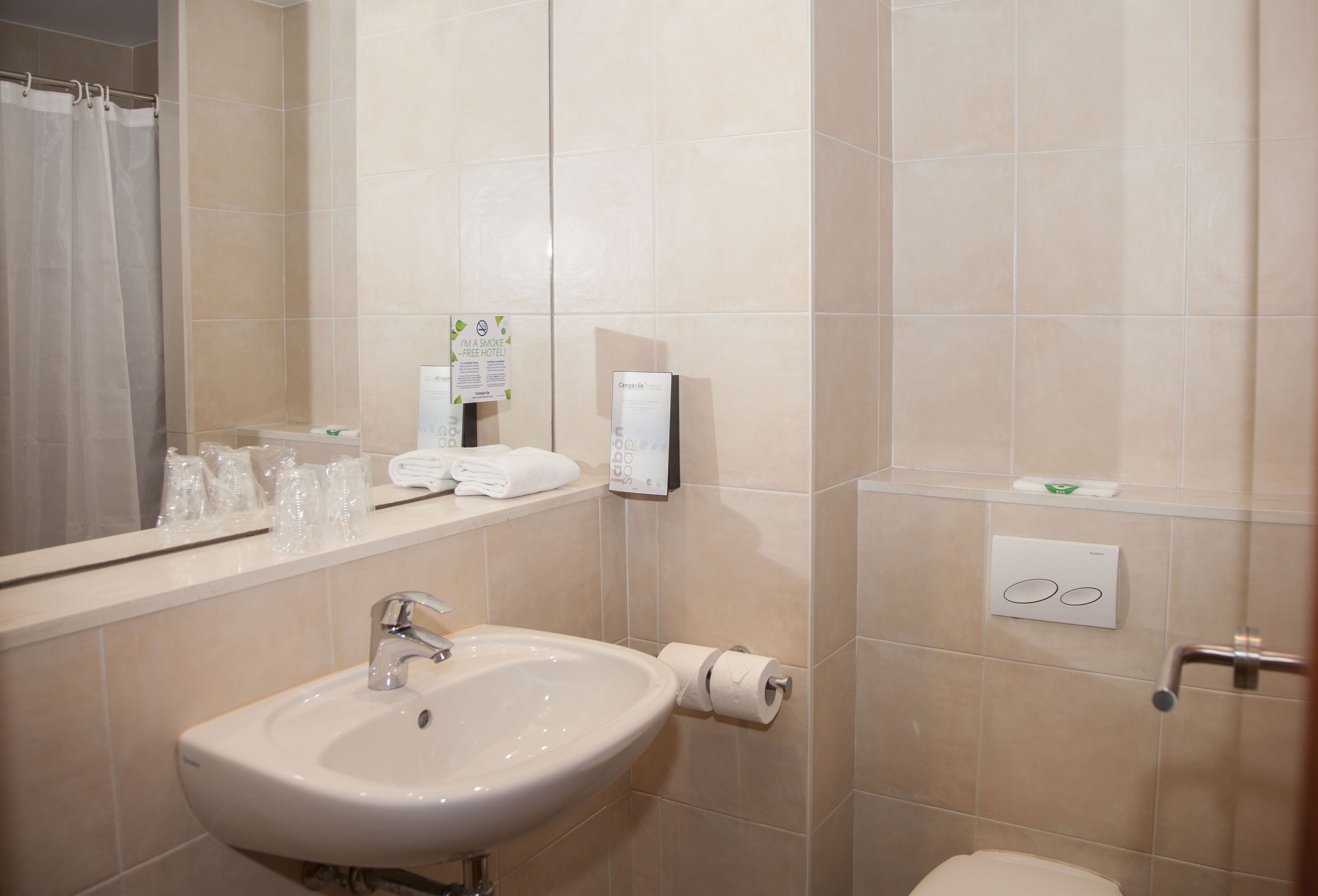 eco-friendly toiletries, hair dryer, towels, shampoo