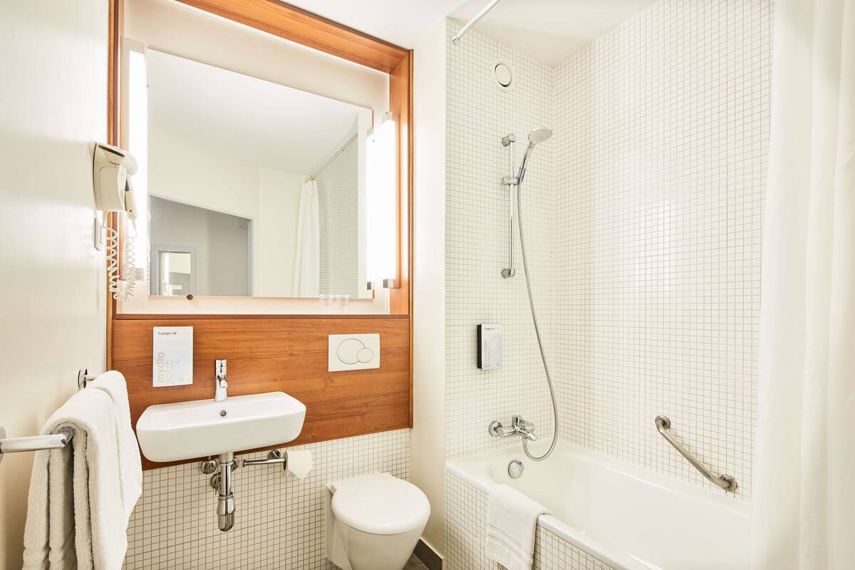 eco-friendly toiletries, hair dryer, towels, soap