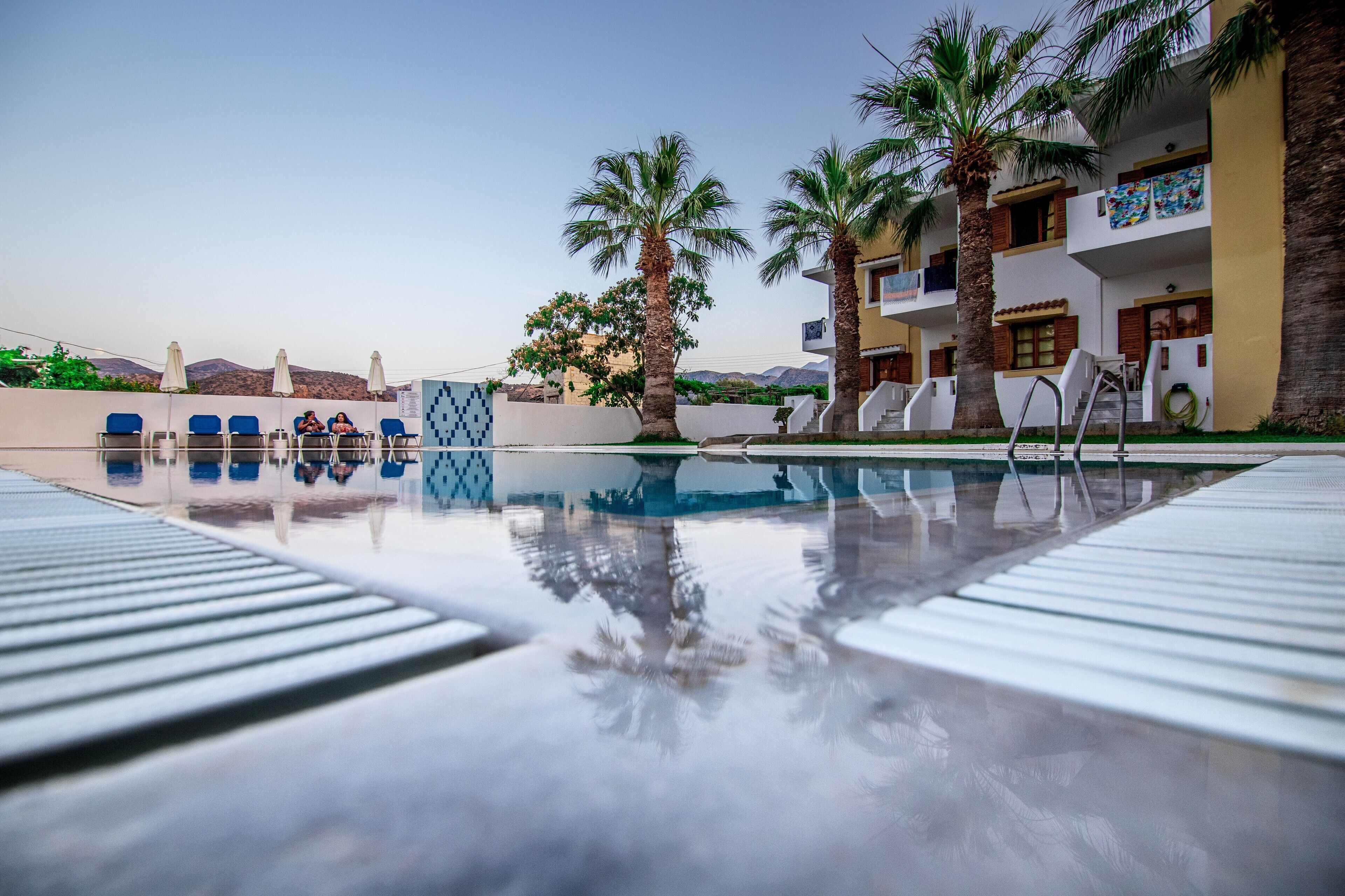 Seasonal outdoor pool, open 8:00 AM to 8:00 PM, pool umbrellas