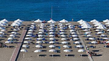 Private beach, sun-loungers, beach umbrellas, beach bar