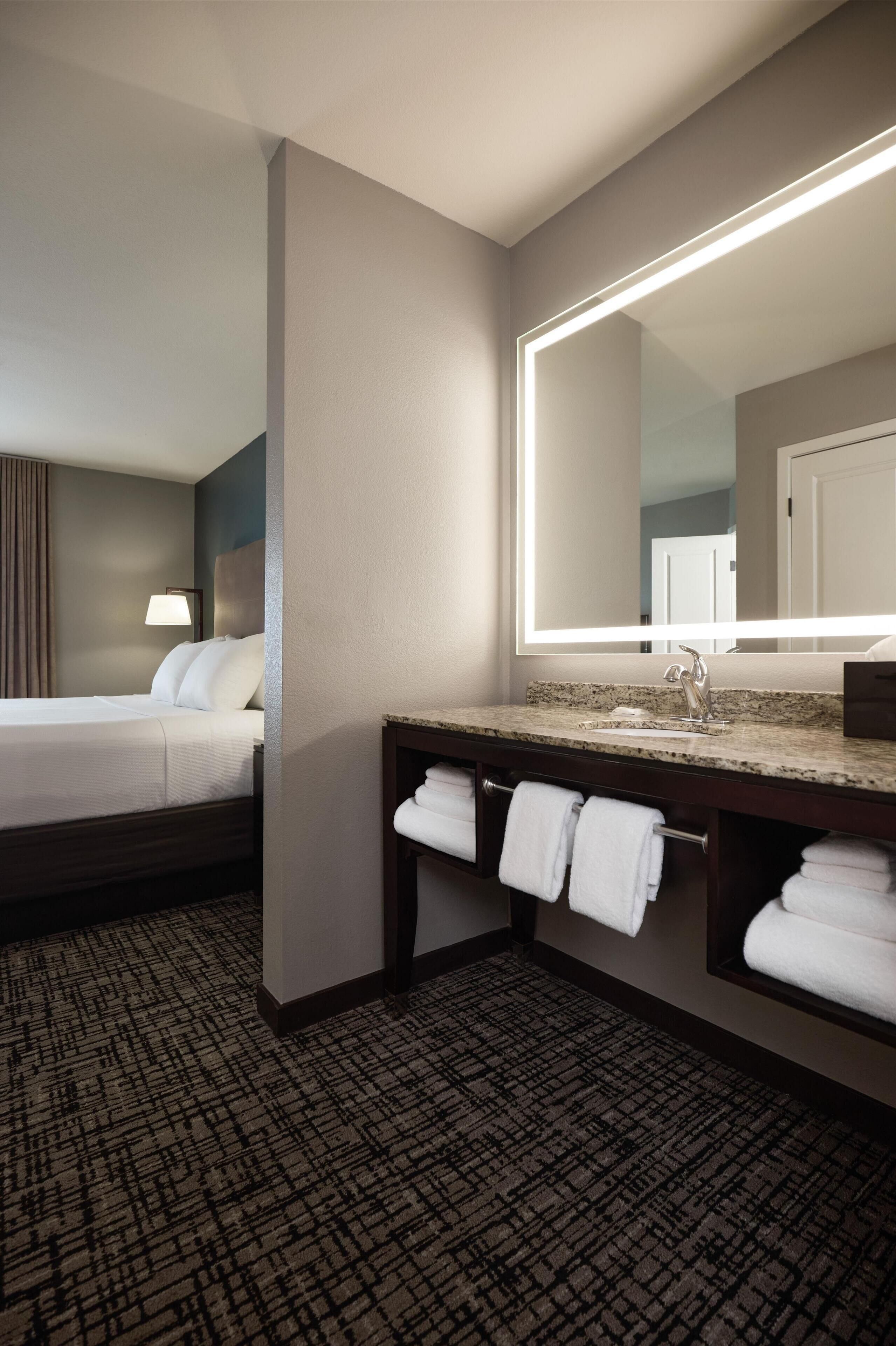 hypo-allergenic bedding, pillow-top beds, desk, laptop workspace