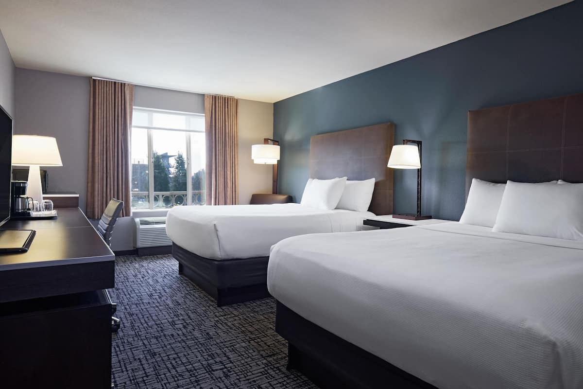 Hypo-allergenic bedding, pillowtop beds, desk, laptop workspace