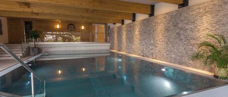 Indoor pool, pool umbrellas, sun loungers