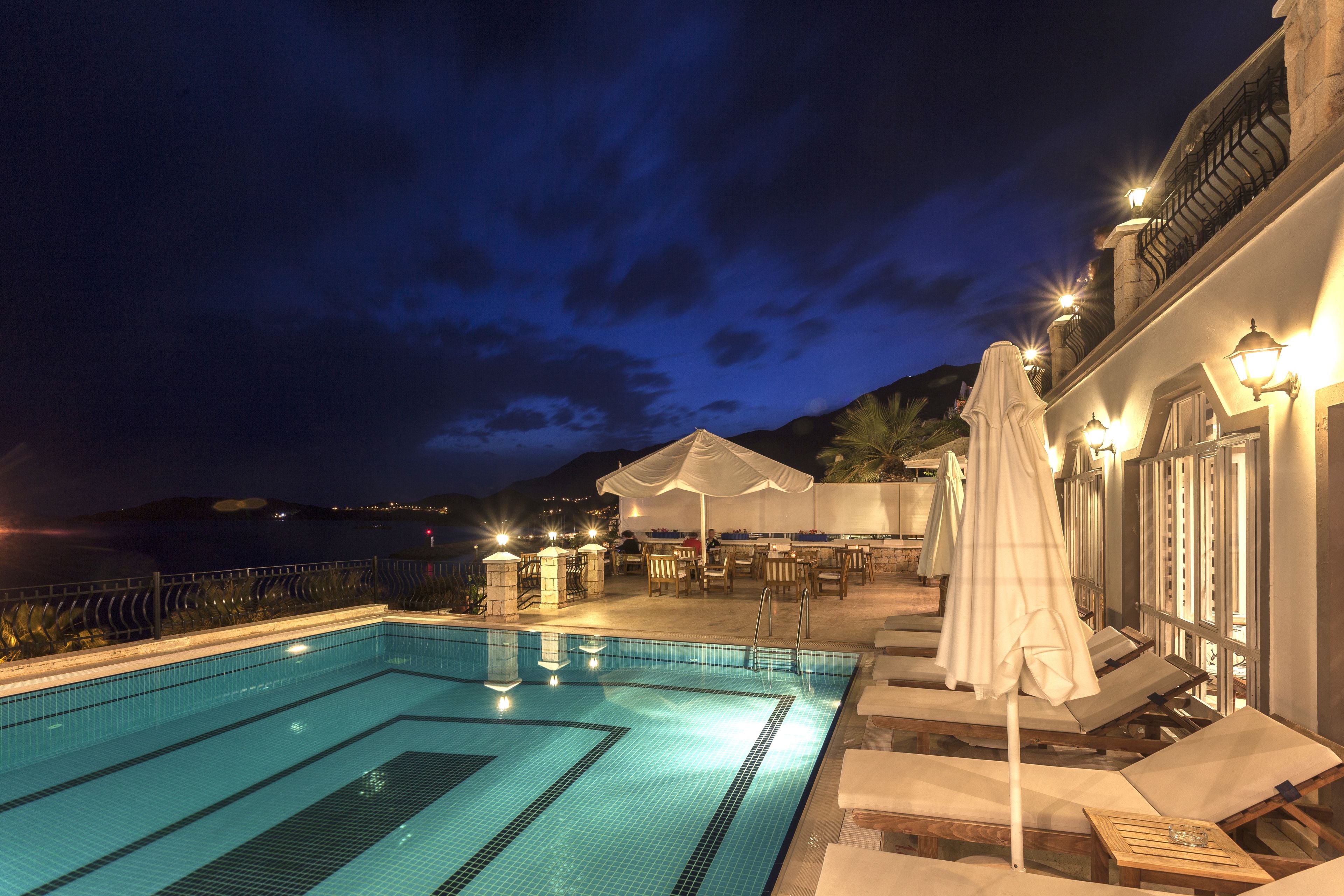 outdoor pool, pool umbrellas, pool loungers