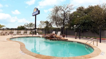 Outdoor pool, open 8 AM to 10 PM, pool umbrellas, pool loungers