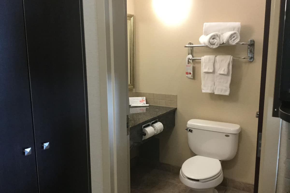 premium bedding, desk, blackout curtains, iron/ironing board