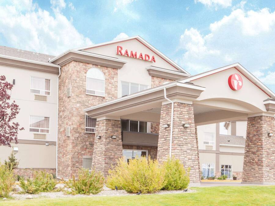 A multi-story building with a prominent "RAMADA" sign on the facade.