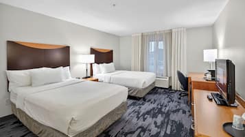 Hypo-allergenic bedding, desk, laptop workspace, blackout drapes