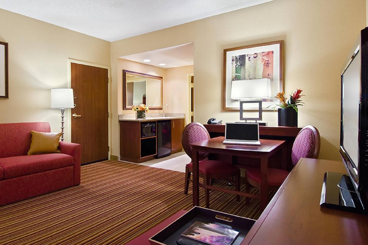 Suite, 1 King Bed, Accessible, Bathtub | Living area | LCD TV, pay movies