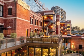 A multi-story building with a brick facade, a visible sign reading 'MUSTARD BUILDING,' and a balcony area with seating. - Fairmont Heritage Place, Ghirardelli Square (San Francisco)