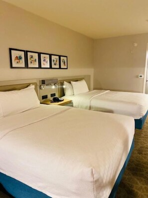 Two queen beds evolution | Hypo-allergenic bedding, desk, laptop workspace, iron/ironing board