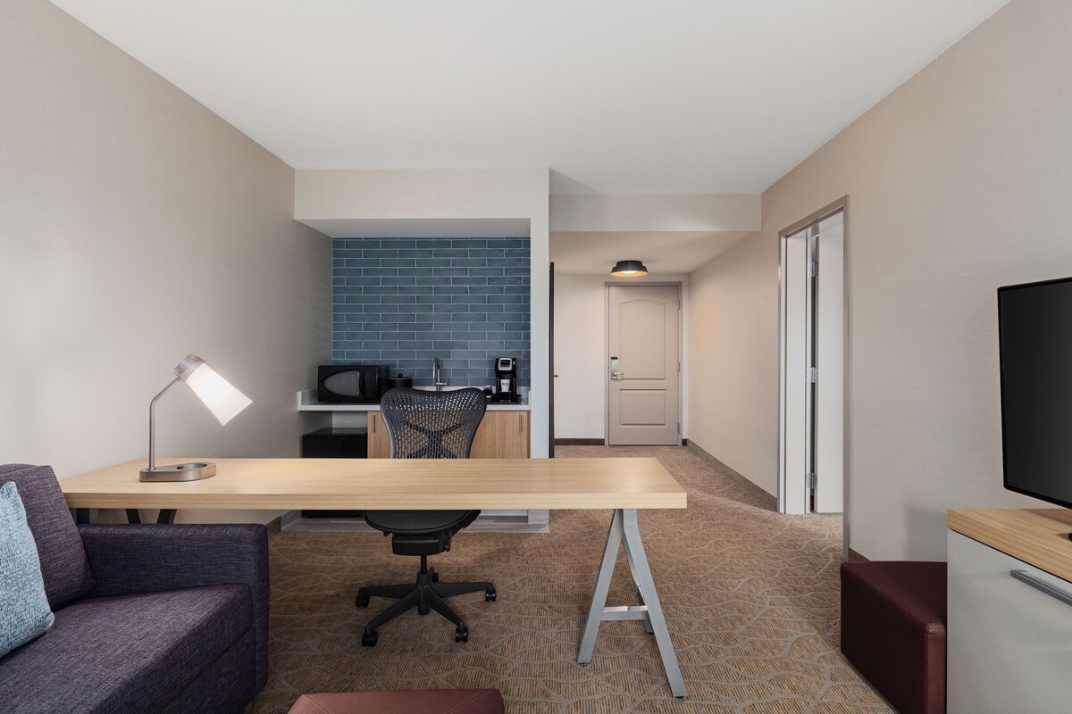 Suite, 1 King Bed | Living area | 34-inch TV with satellite channels