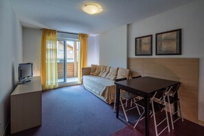 Apartment, 1 Bedroom | Living area | 32-inch flat-screen TV with digital channels, TV