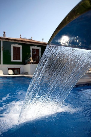 Outdoor pool, pool loungers. Hotel Palau Verd Adults Only