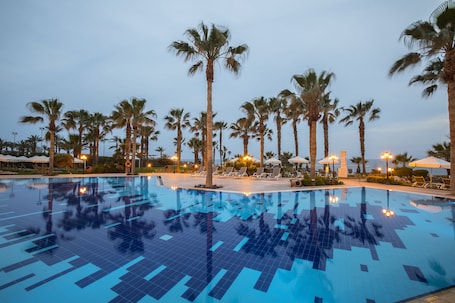 Indoor pool, outdoor pool, pool umbrellas, sun loungers