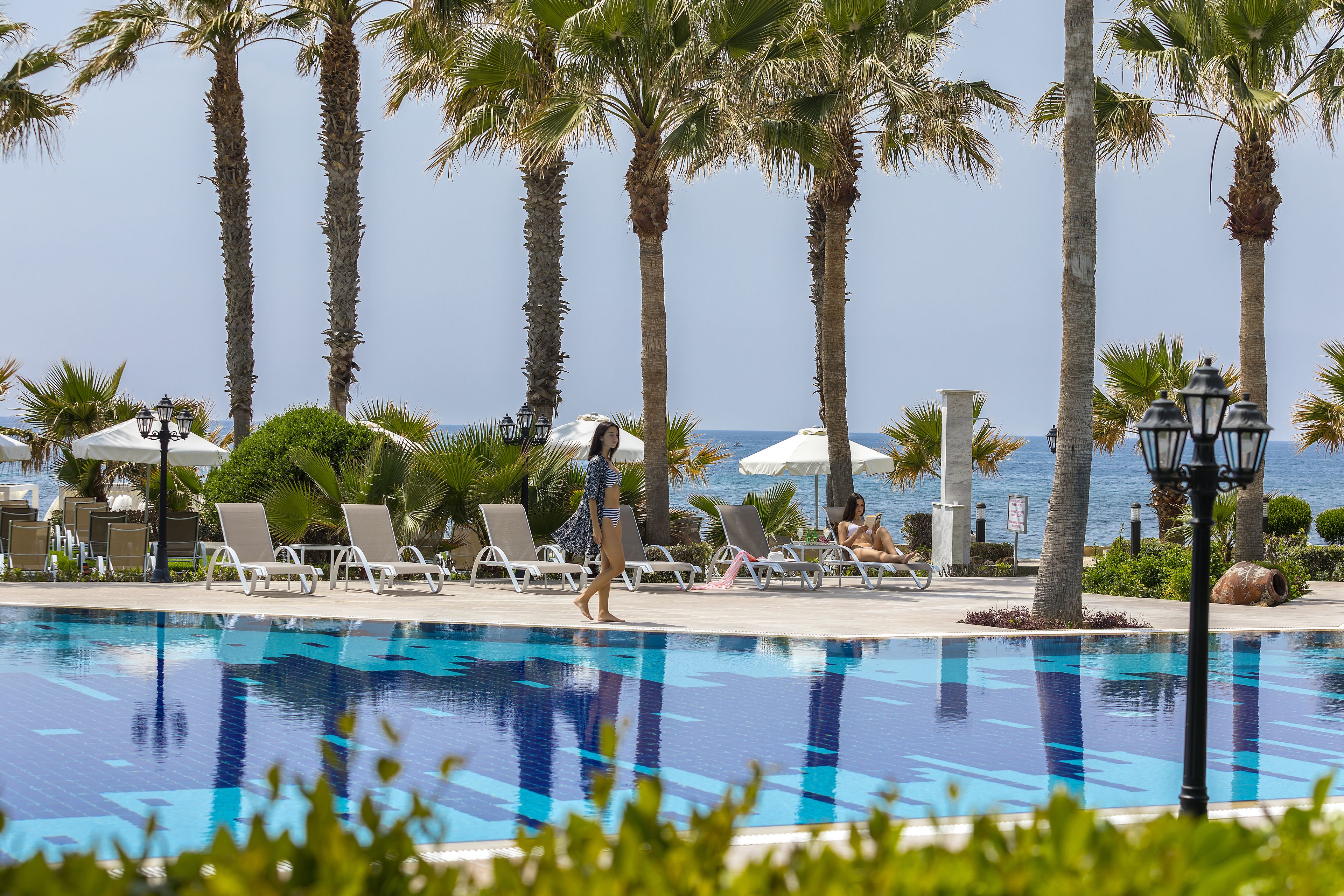 indoor pool, outdoor pool, pool umbrellas, pool loungers