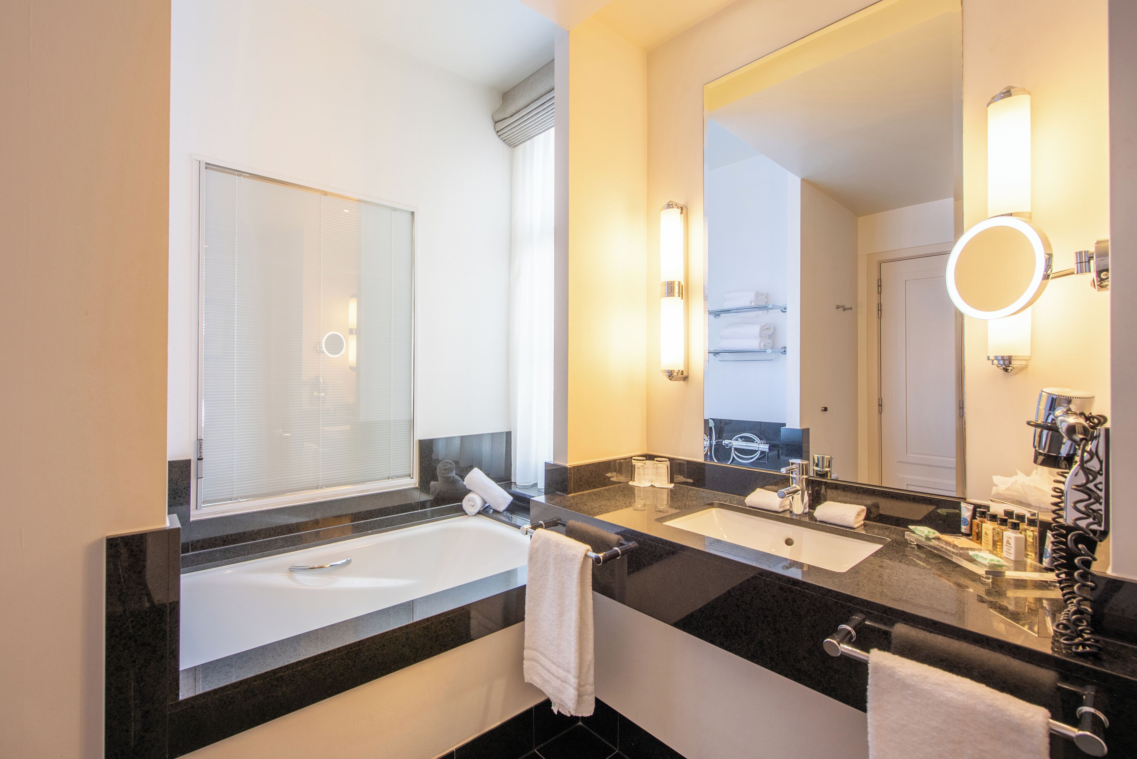 deluxe double or twin room | bathroom | hair dryer, bathrobes, slippers, towels