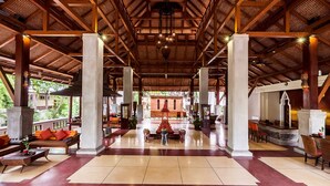 A spacious lobby with high ceilings, large columns, and a central seating area. - Muang Samui Spa Resort (Koh Samui)