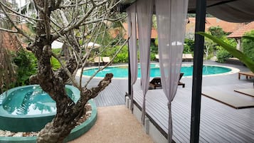 Outdoor pool, open 7:30 AM to 9:00 PM, pool umbrellas