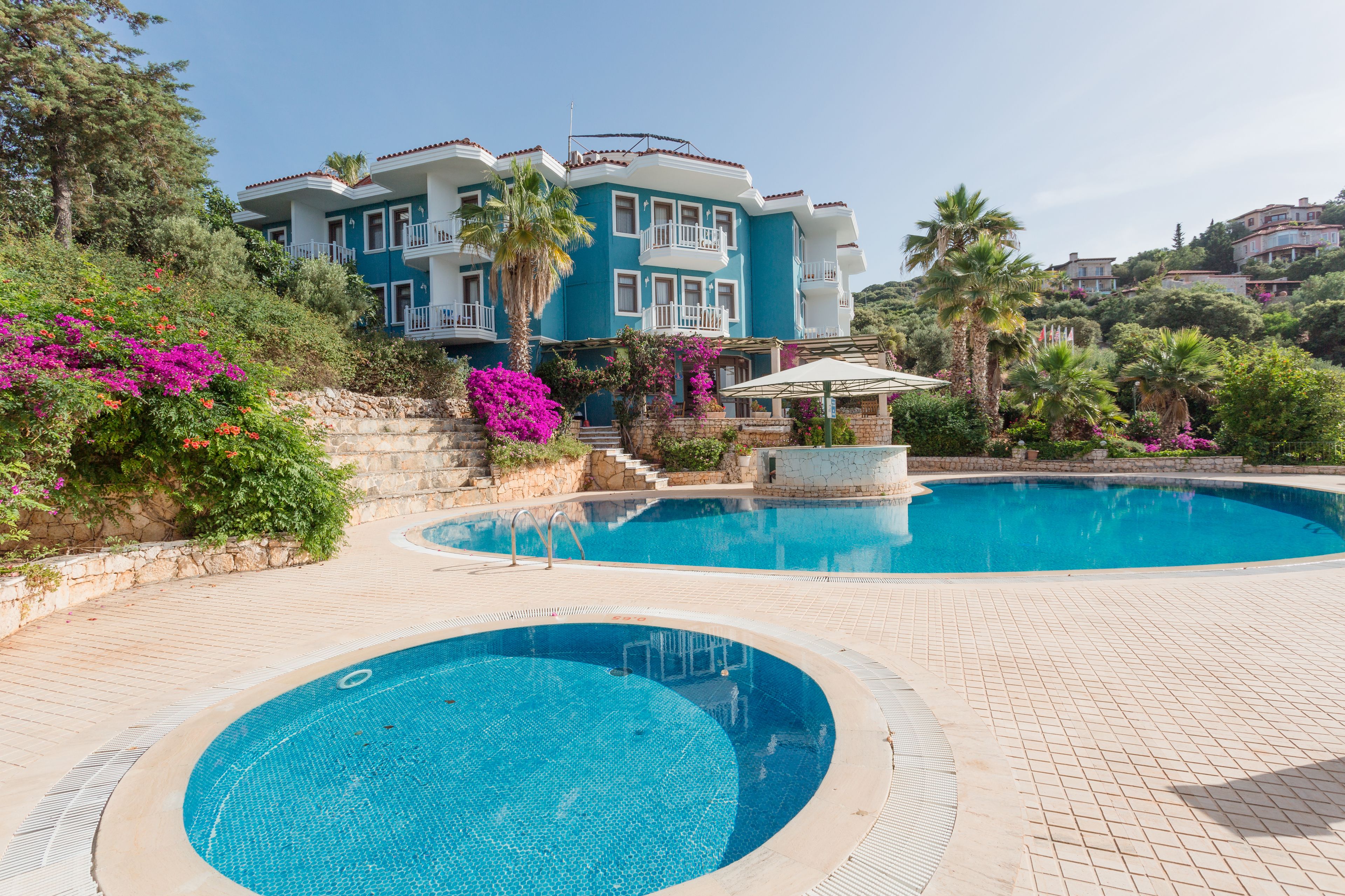 outdoor pool, pool umbrellas, pool loungers