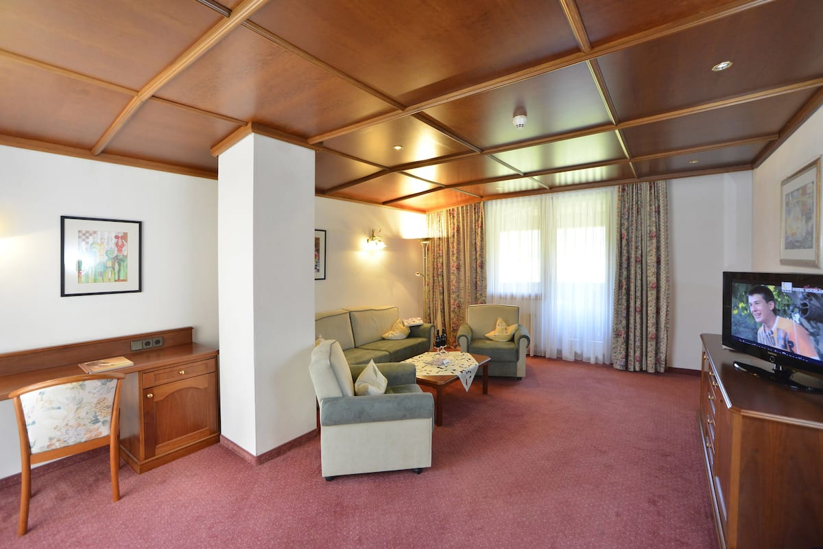 Suite, 3 Bedrooms, 2 Bathrooms (Tirol) | Living area | 55-inch flat-screen TV with digital channels, TV