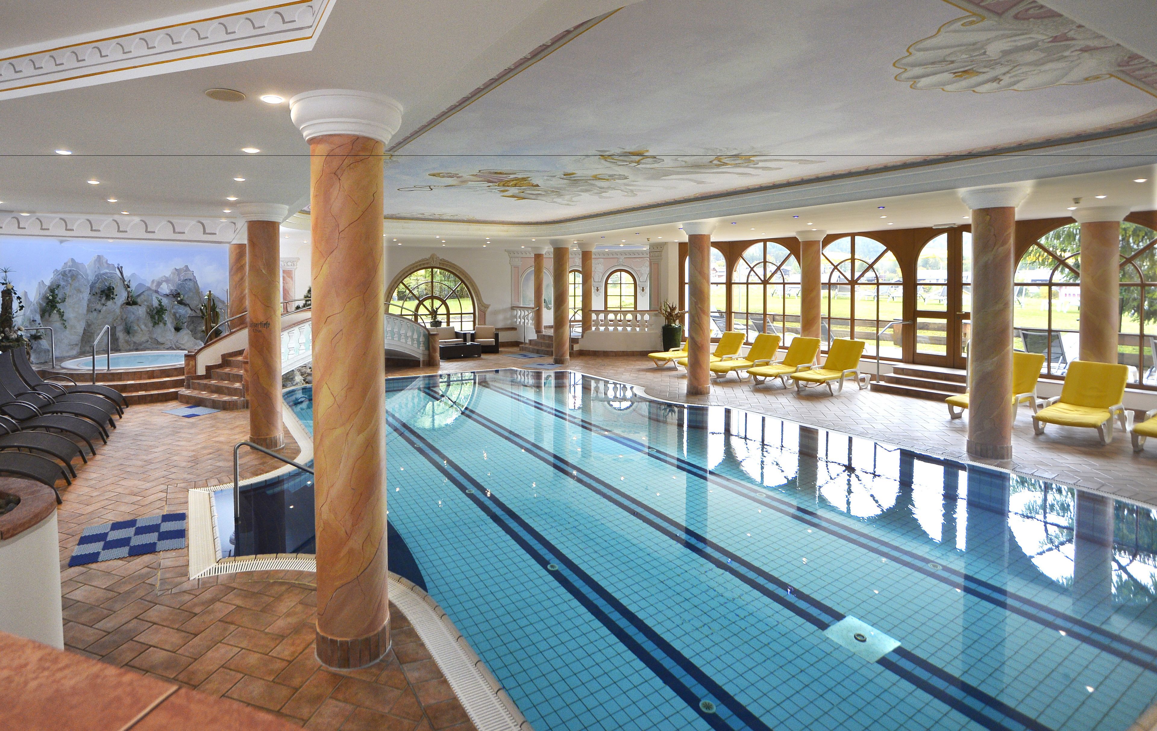 indoor pool, pool umbrellas, pool loungers