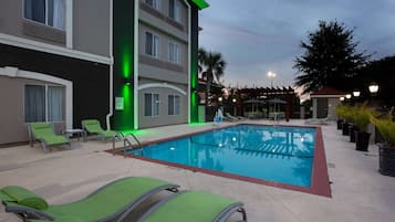 Outdoor pool, open 7:00 AM to 10:00 PM, pool umbrellas, sun loungers